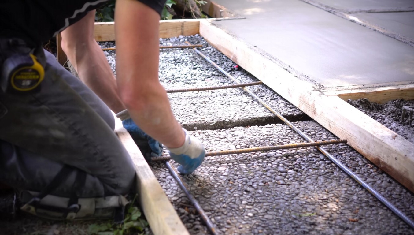 Concrete foundation installation with rebar forming and gravel base in Cupertino, CA